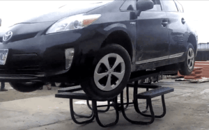 car on commercial picnic tables